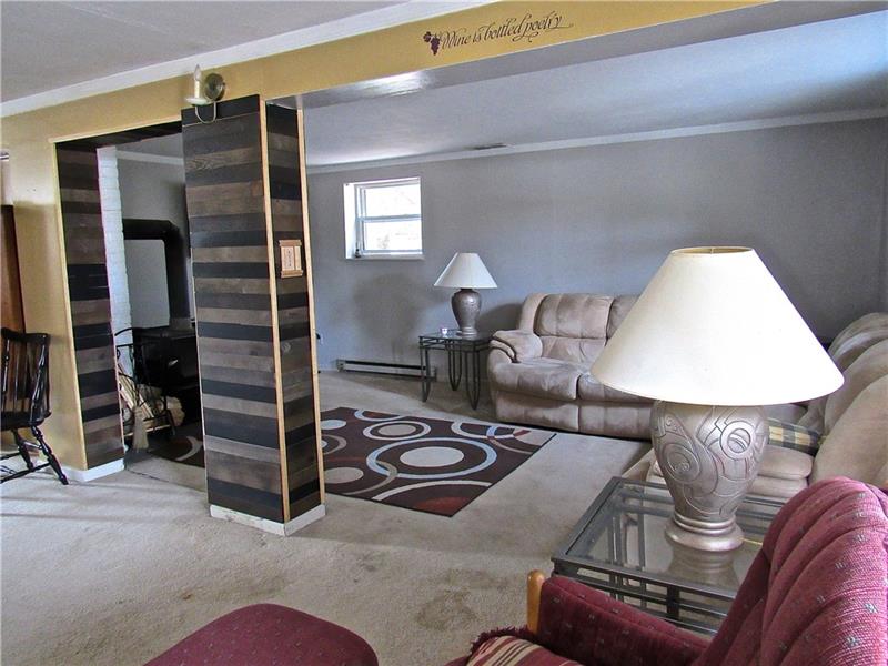 106 Pearce Road Mars, PA 16046 - Photo 11 of 20 Living/family Room includes wood burning stove for additional heat source in cool seasons.