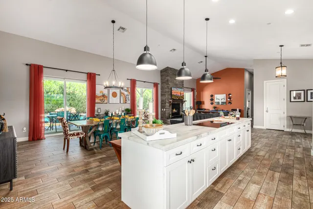 a kitchen with stainless steel appliances kitchen island a refrigerator and a stove