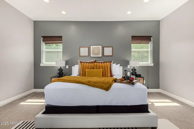 a bathroom with a granite countertop sink a toilet and shower