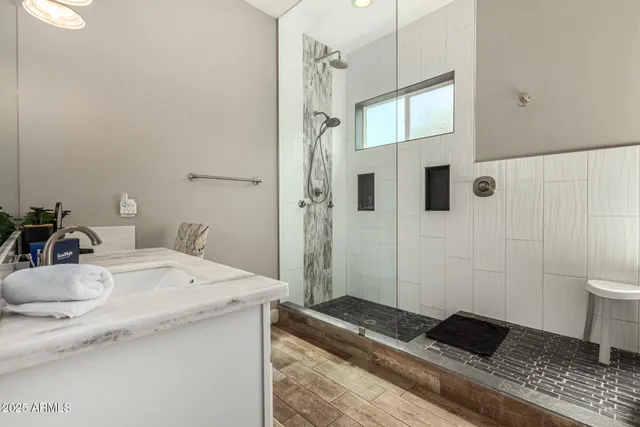 a spacious bathroom with a bathtub and sink