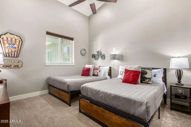 a bedroom with a bed and a large window