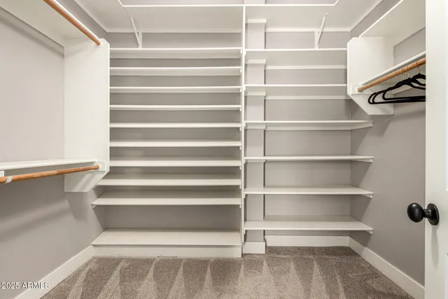 a view of swimming pool with outdoor seating and a garden