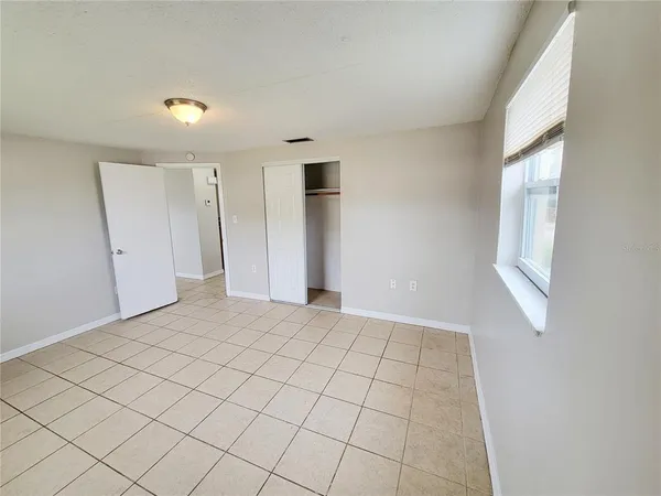 a view of an empty room and window