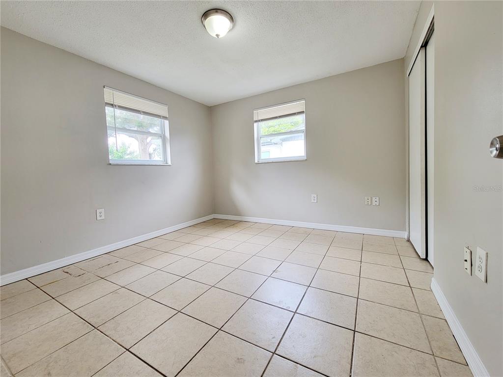 7341 Mayfield Drive Port Richey, FL 34668 - Photo 14 of 20 a view of an empty room and window