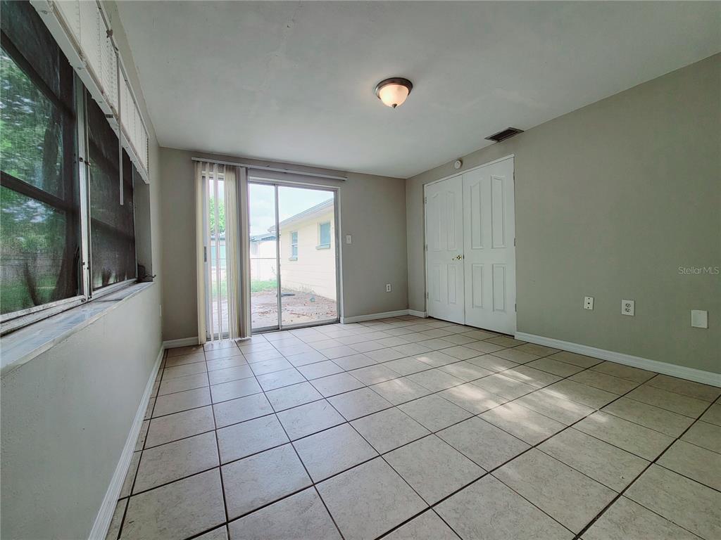 7341 Mayfield Drive Port Richey, FL 34668 - Photo 19 of 20 a view of an empty room and window