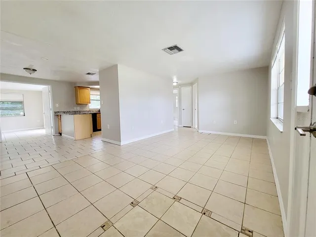 a view of an empty room and window