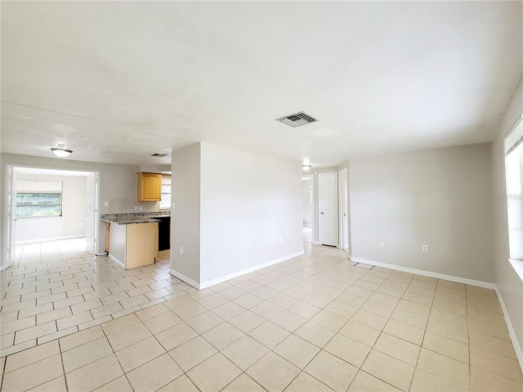 7341 Mayfield Drive Port Richey, FL 34668 - Photo 3 of 20 a view of an empty room and window