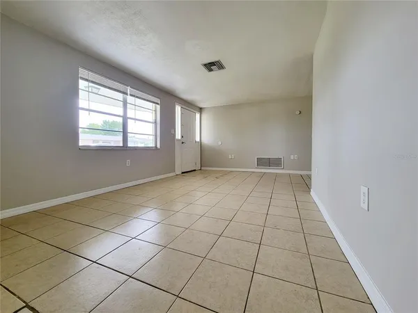 a view of an empty room and window