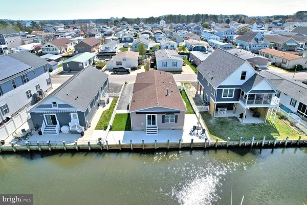 a view of a house with a wooden fence