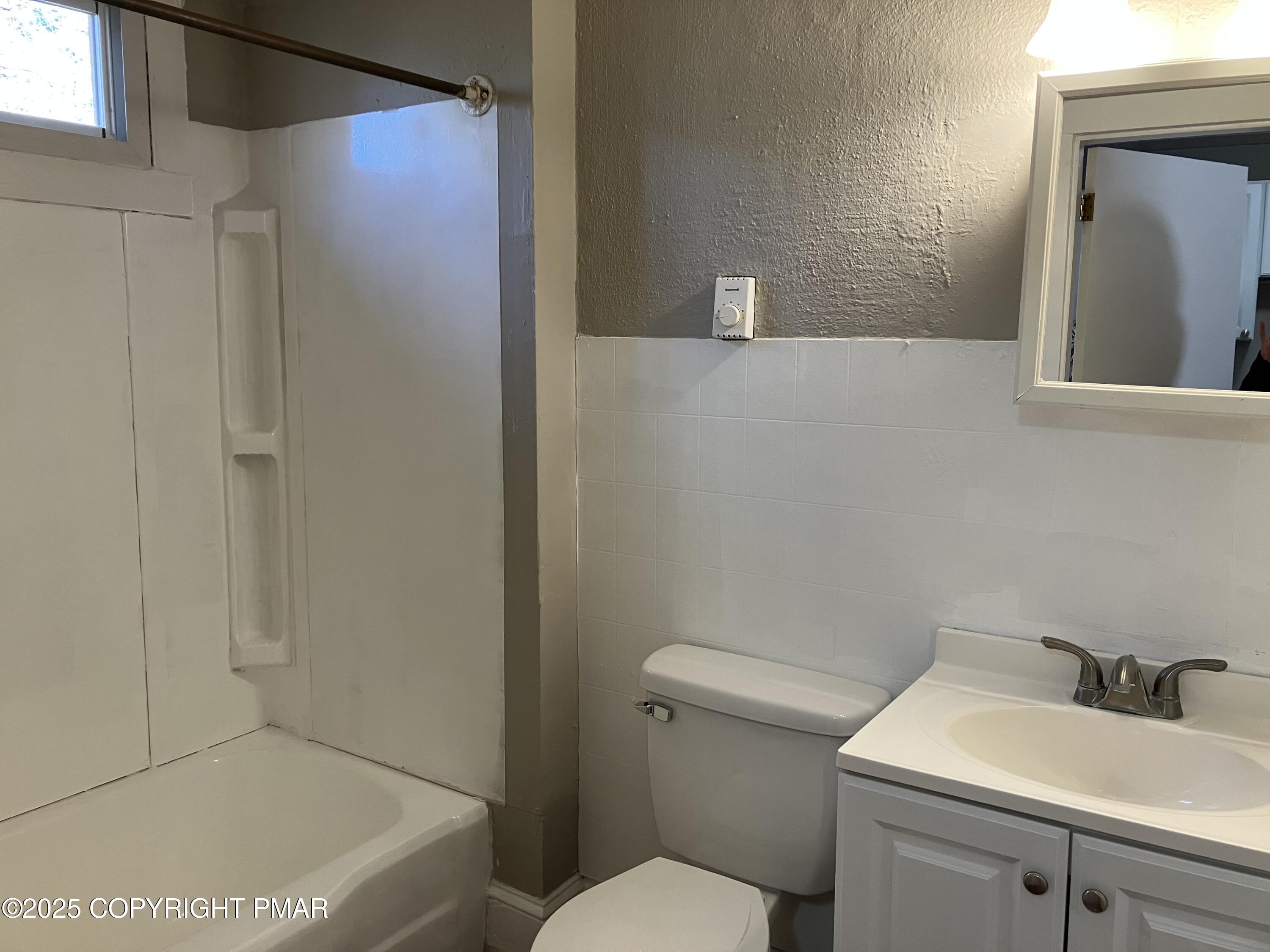 383 Old Rte 940, Unit 301 Pocono Pines, PA 18350 - Photo 5 of 10 a bathroom with a sink a toilet and shower
