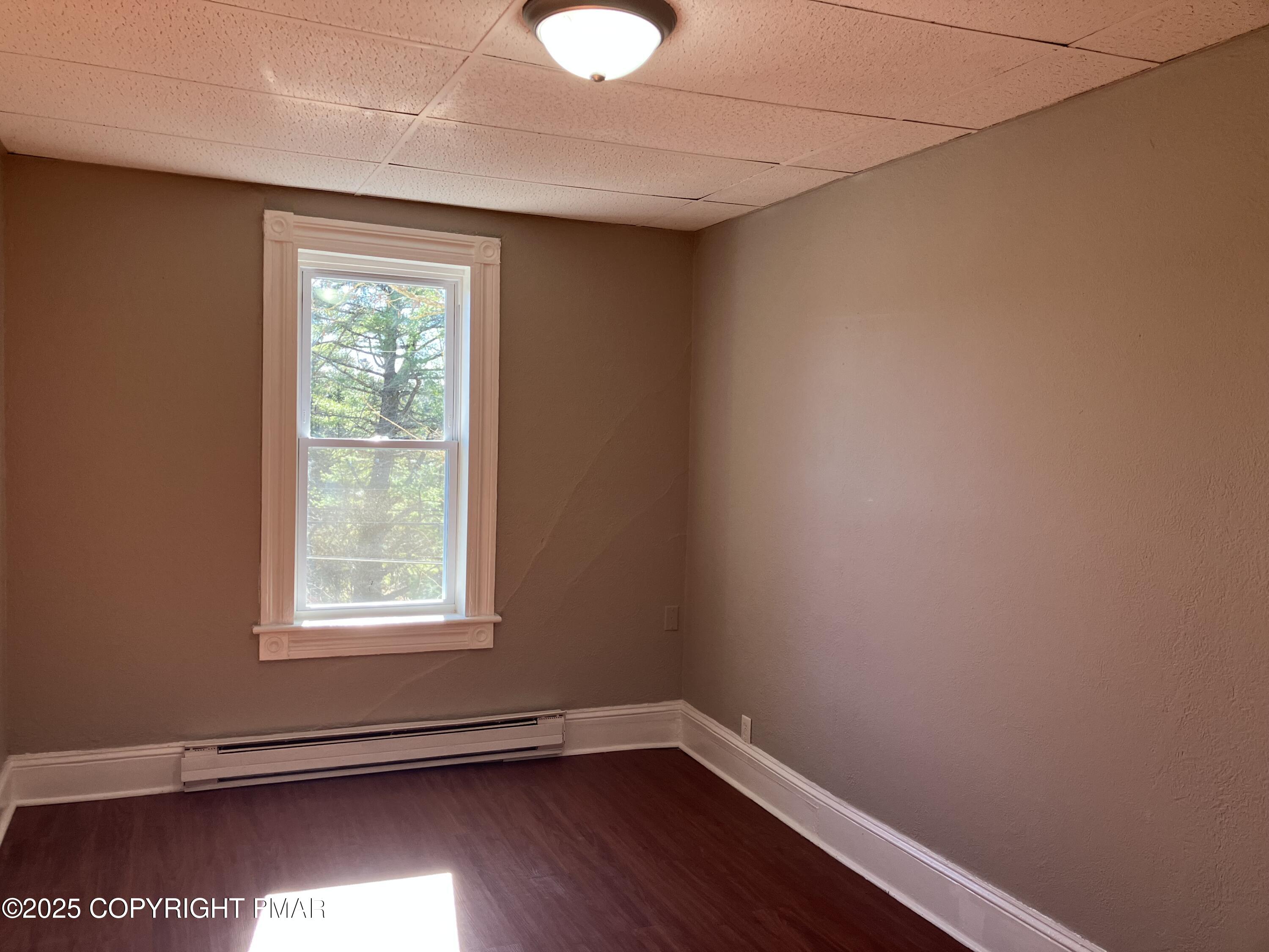 383 Old Rte 940, Unit 301 Pocono Pines, PA 18350 - Photo 7 of 10 a view of a room with wooden floor and windows