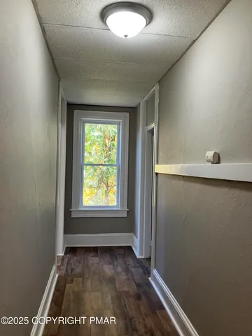 a view of an empty room and window