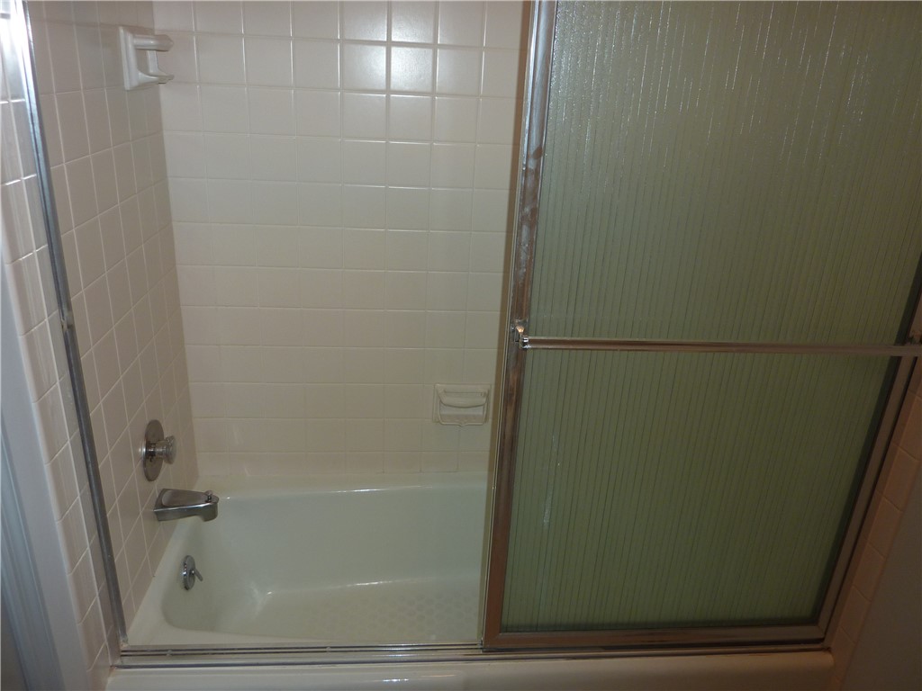 1345 Tattersall Road, Unit 64 Dayton, OH 45459 - Photo 20 of 25 This functional bathroom features a tub and shower combination with practical sliding glass doors.