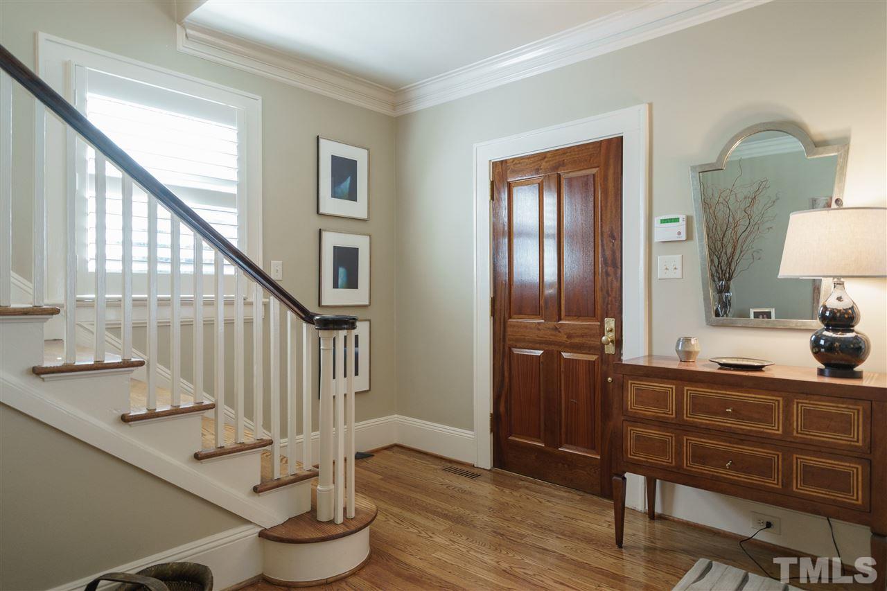 2505 Beechridge Road Raleigh, NC 27608 - Photo 3 of 25 a view of entryway bedroom and hall with wooden floor