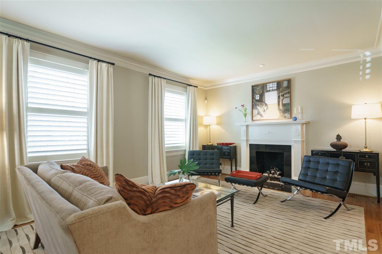 2505 Beechridge Road Raleigh, NC 27608 - Photo 6 of 25 a living room with furniture and a fireplace