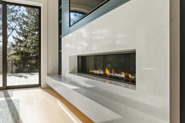 a living room with a fireplace and a floor to ceiling window