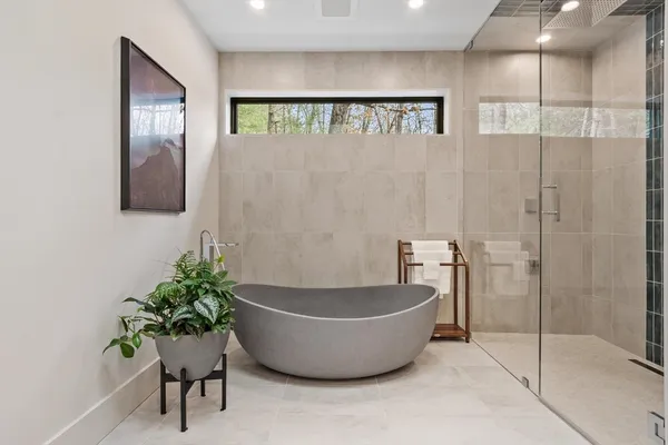 a white bath tub sitting in a bathroom