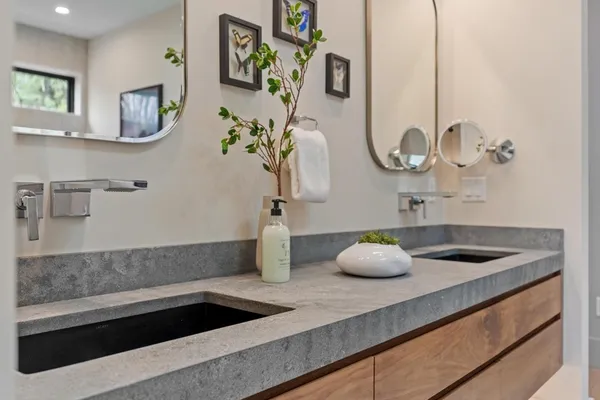 a bathroom with a sink and vanity