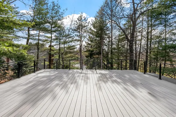 a view of outdoor space with deck and tree