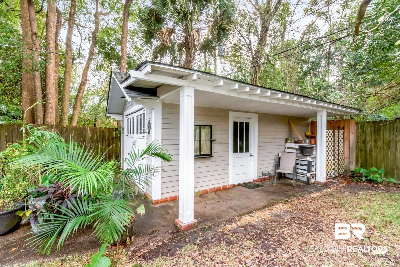 135 Silverwood Street Mobile, AL 36607 - Photo 26 of 32 View of outbuilding with a fenced backyard