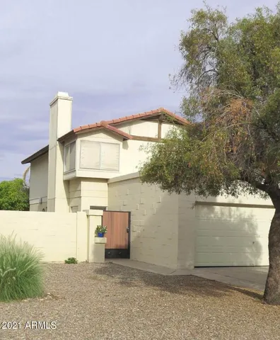 a view of a small house with a window