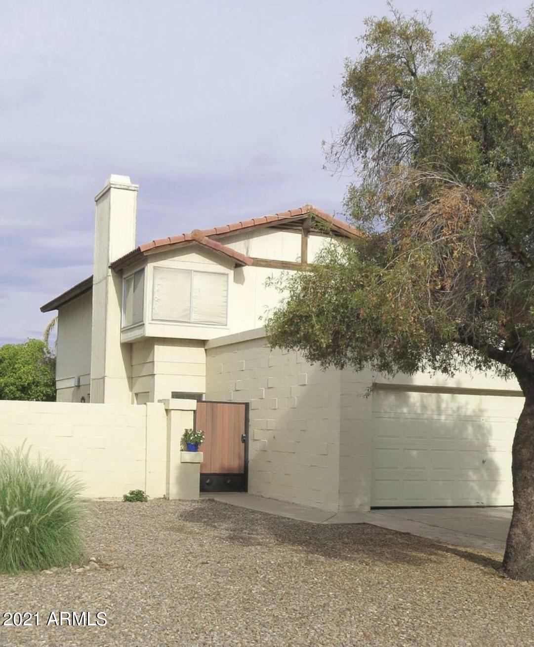 a view of a small house with a window