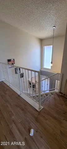 a view of wooden floor in hallway