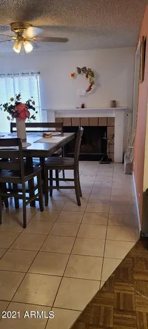 a view of a dining room with furniture and chandelier