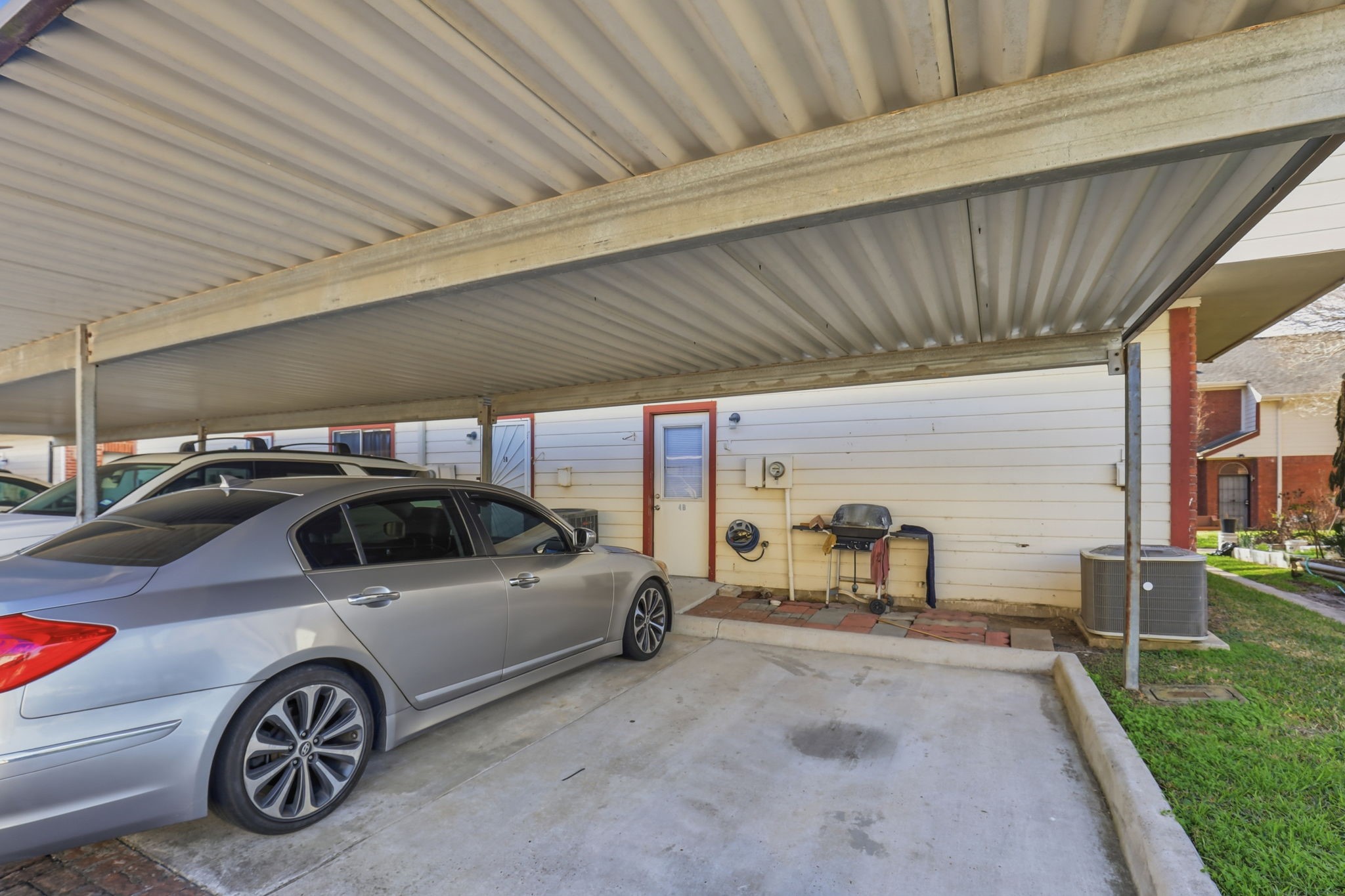 8320 Wild Rose Street, Unit 4B Houston, TX 77083 - Photo 16 of 16 a view of a car in garage