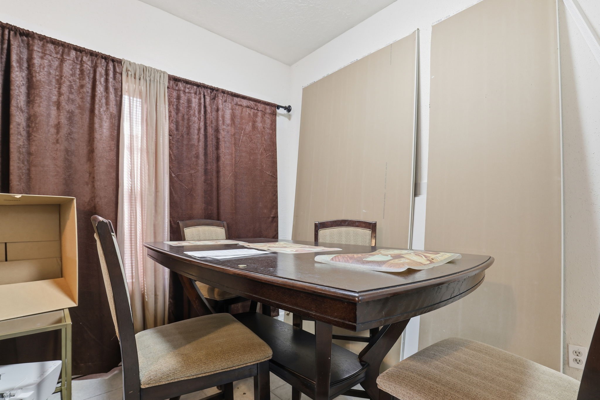 8320 Wild Rose Street, Unit 4B Houston, TX 77083 - Photo 8 of 16 a view of a dining room with furniture