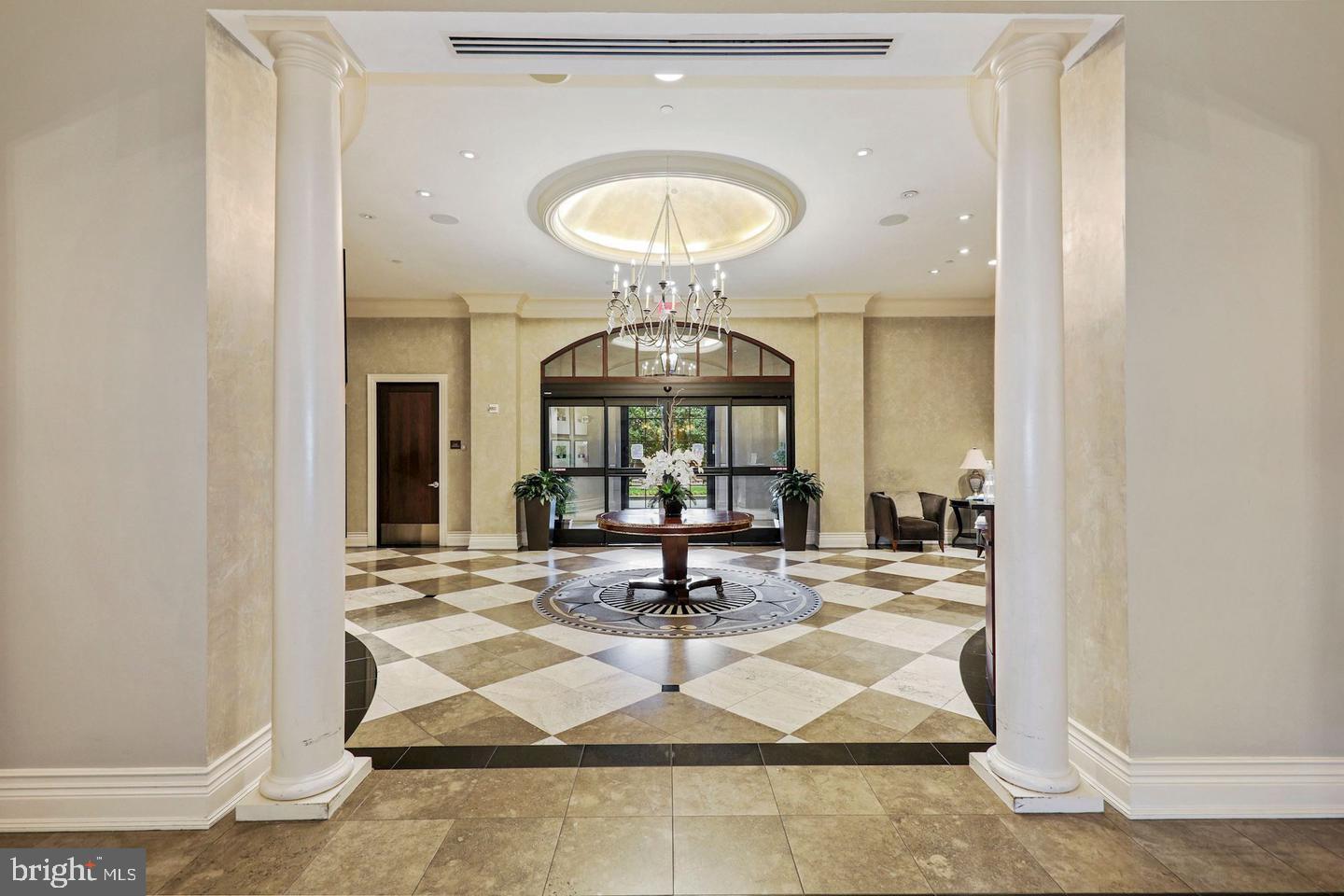 11710 Old Georgetown Road, Unit 1206 North Bethesda, MD 20852 - Photo 13 of 19 a living room with a chandelier
