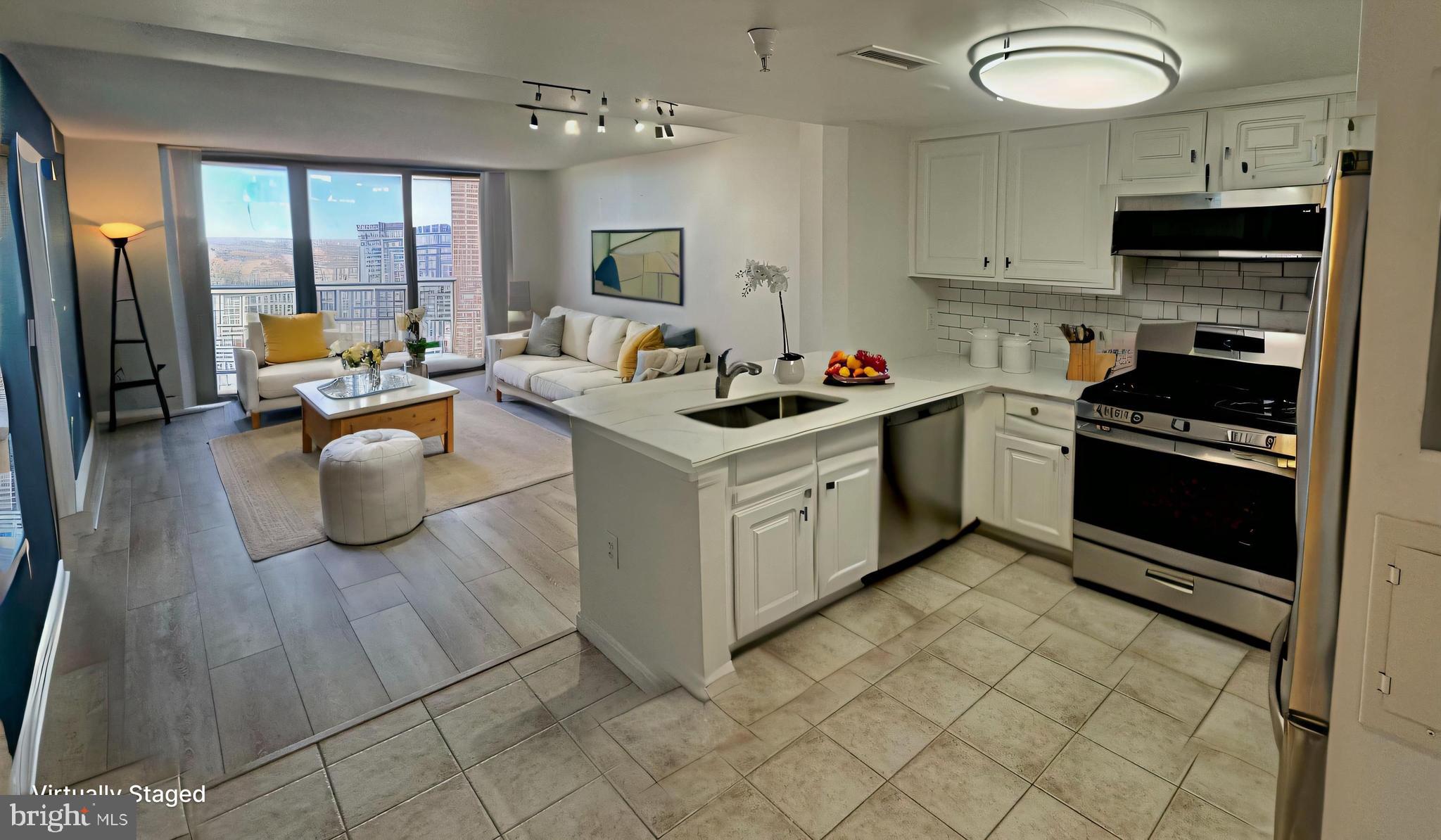 11710 Old Georgetown Road, Unit 1206 North Bethesda, MD 20852 - Photo 2 of 19 a kitchen with a stove and a refrigerator