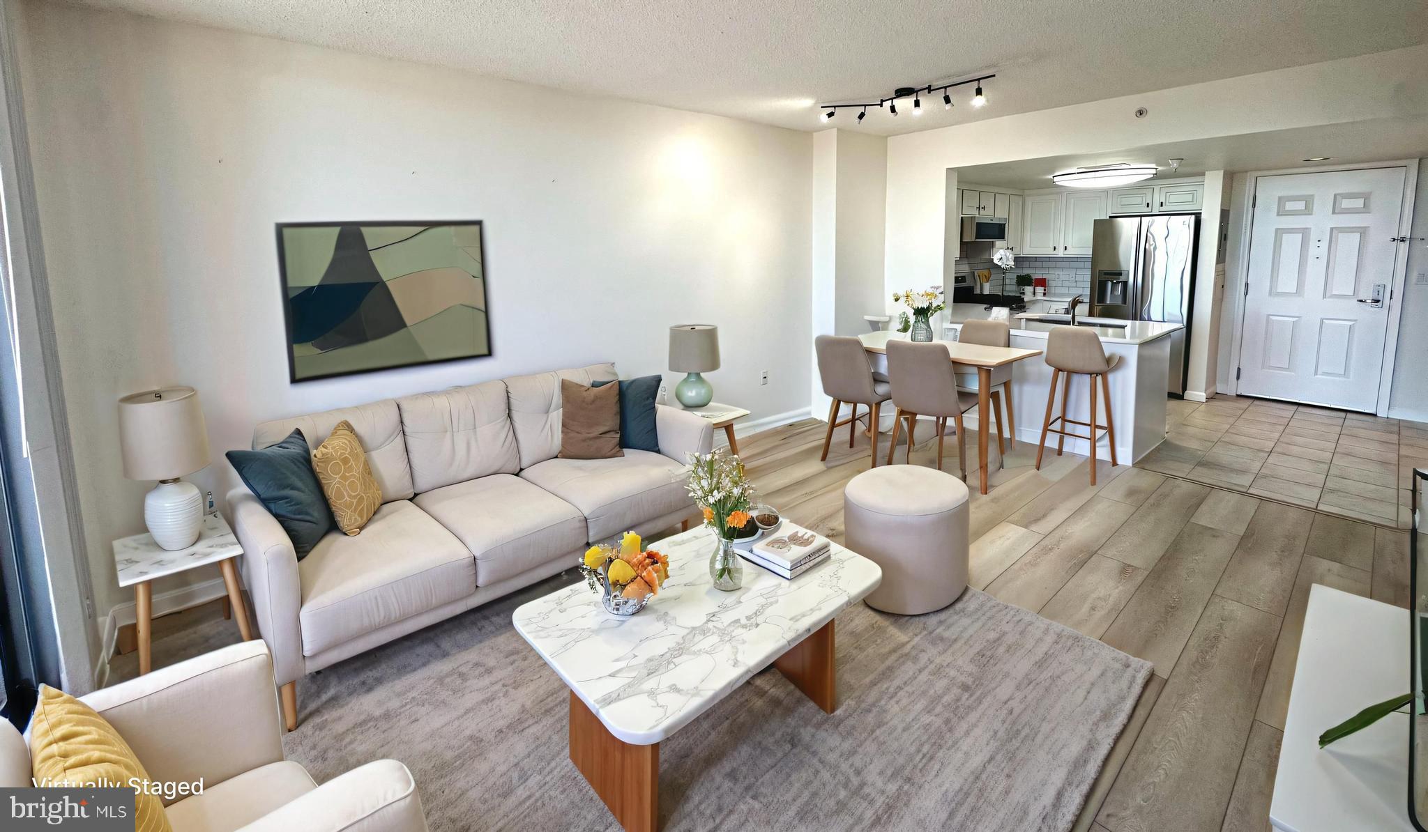 11710 Old Georgetown Road, Unit 1206 North Bethesda, MD 20852 - Photo 4 of 19 a living room with furniture and wooden floor