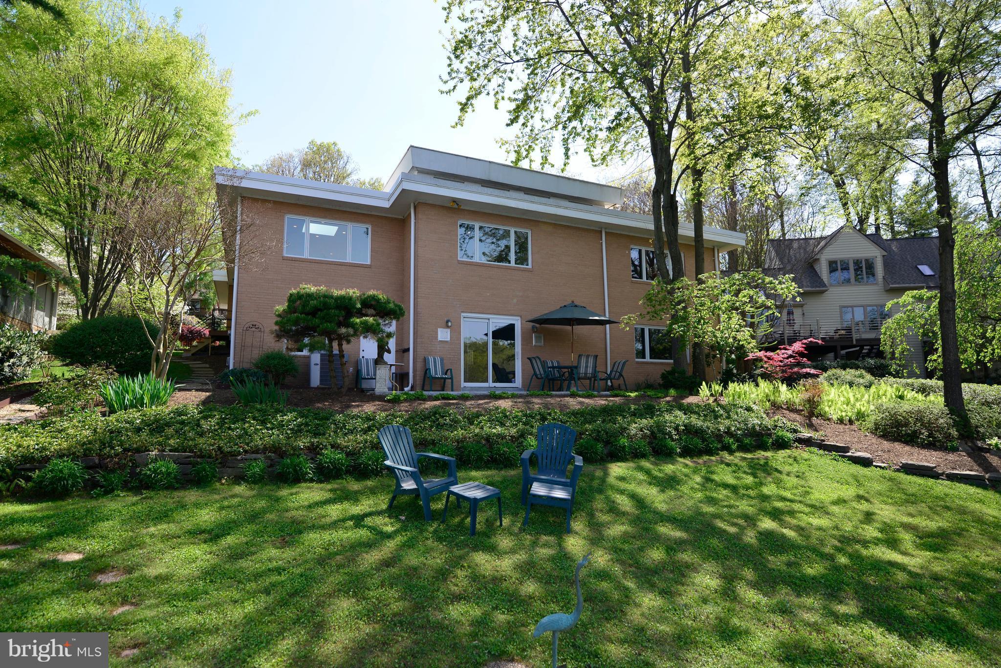 11316 South Shore Road Reston, VA 20190 - Photo 28 of 29 a view of backyard with table and chairs and potted plants