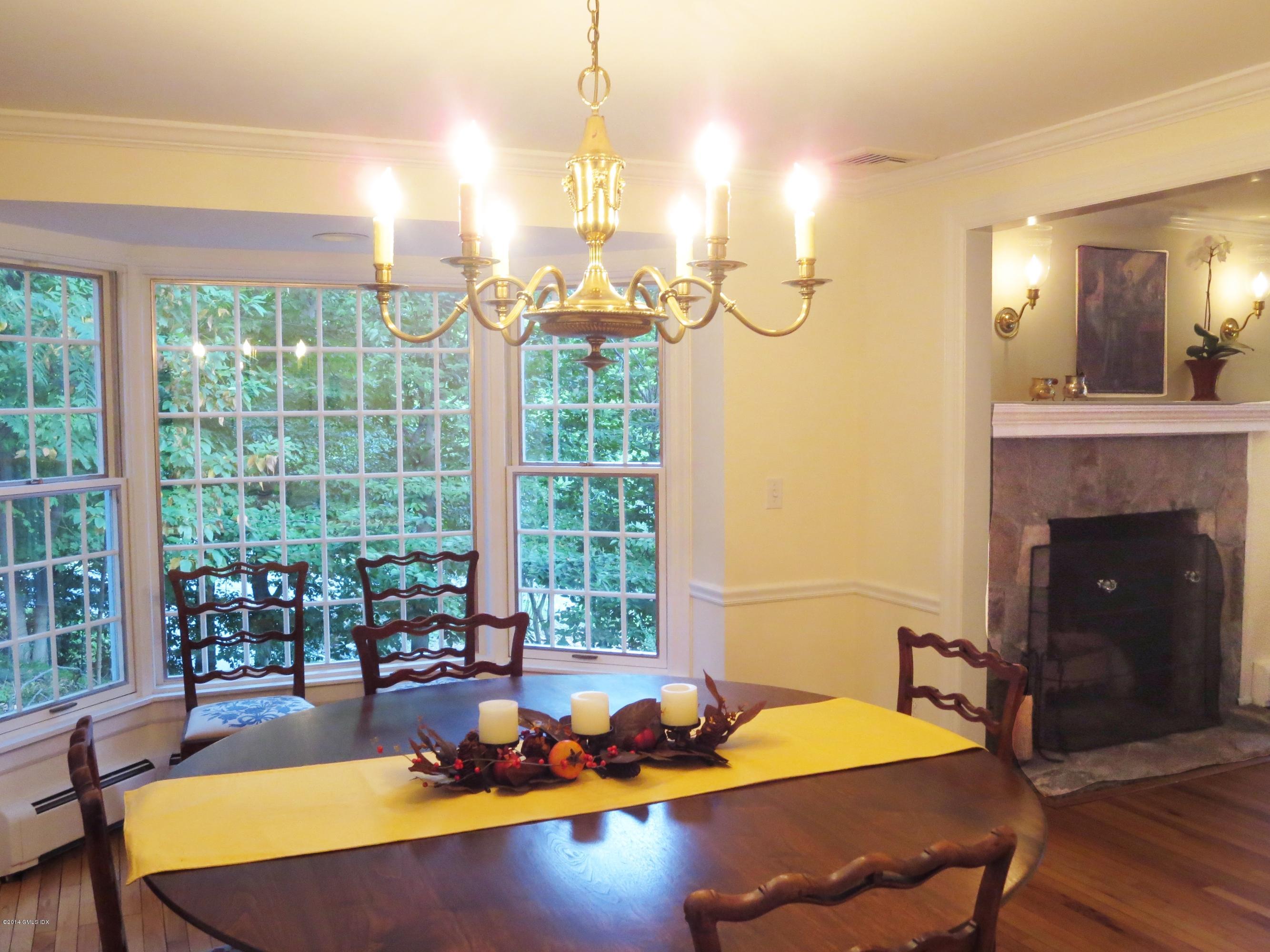 30 Old Stone Bridge Road Cos Cob, CT 06807 - Photo 3 of 21 a living room with a table chairs and a large window with outer view