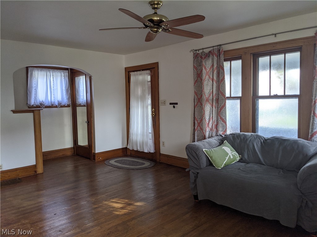 So much character with the arched passageways, hardwood trim and floors.