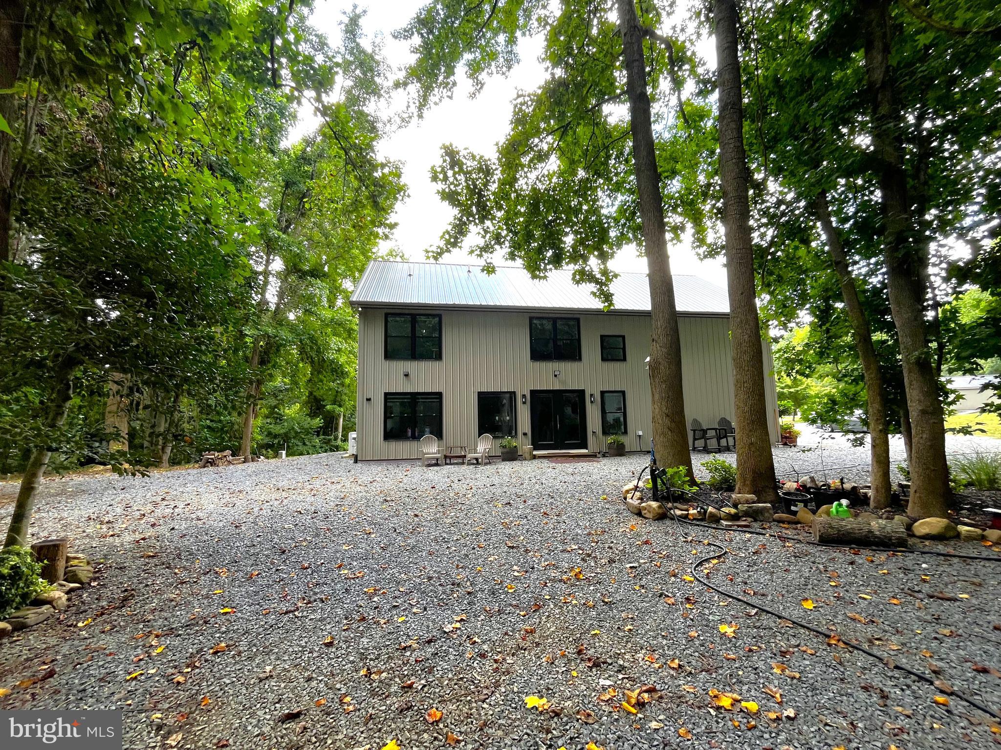 2020 Biglane Court, Unit A Huntingtown, MD 20639 - Photo 1 of 29 a front view of a house with a yard