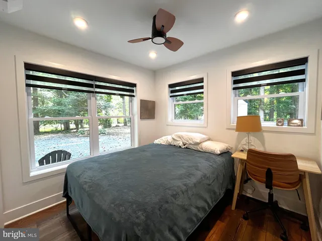 a bedroom with a bed and a table