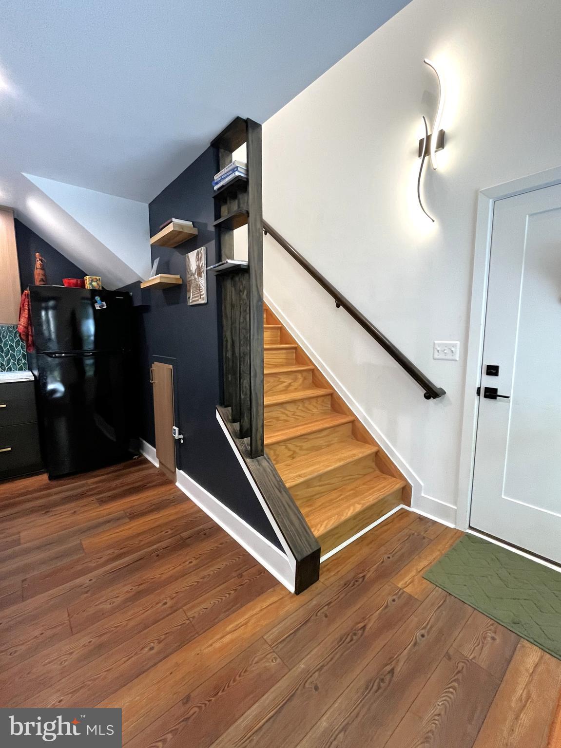 2020 Biglane Court, Unit A Huntingtown, MD 20639 - Photo 17 of 29 a view of entryway and hall with wooden floor