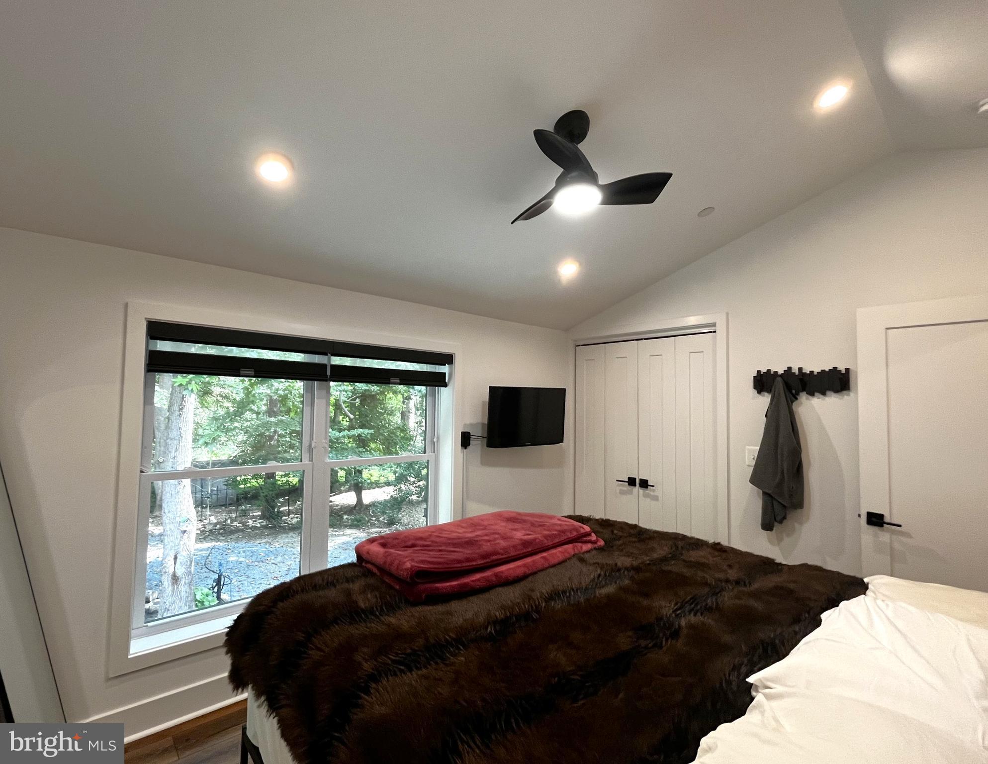 2020 Biglane Court, Unit A Huntingtown, MD 20639 - Photo 20 of 29 a bedroom with a bed and a large window