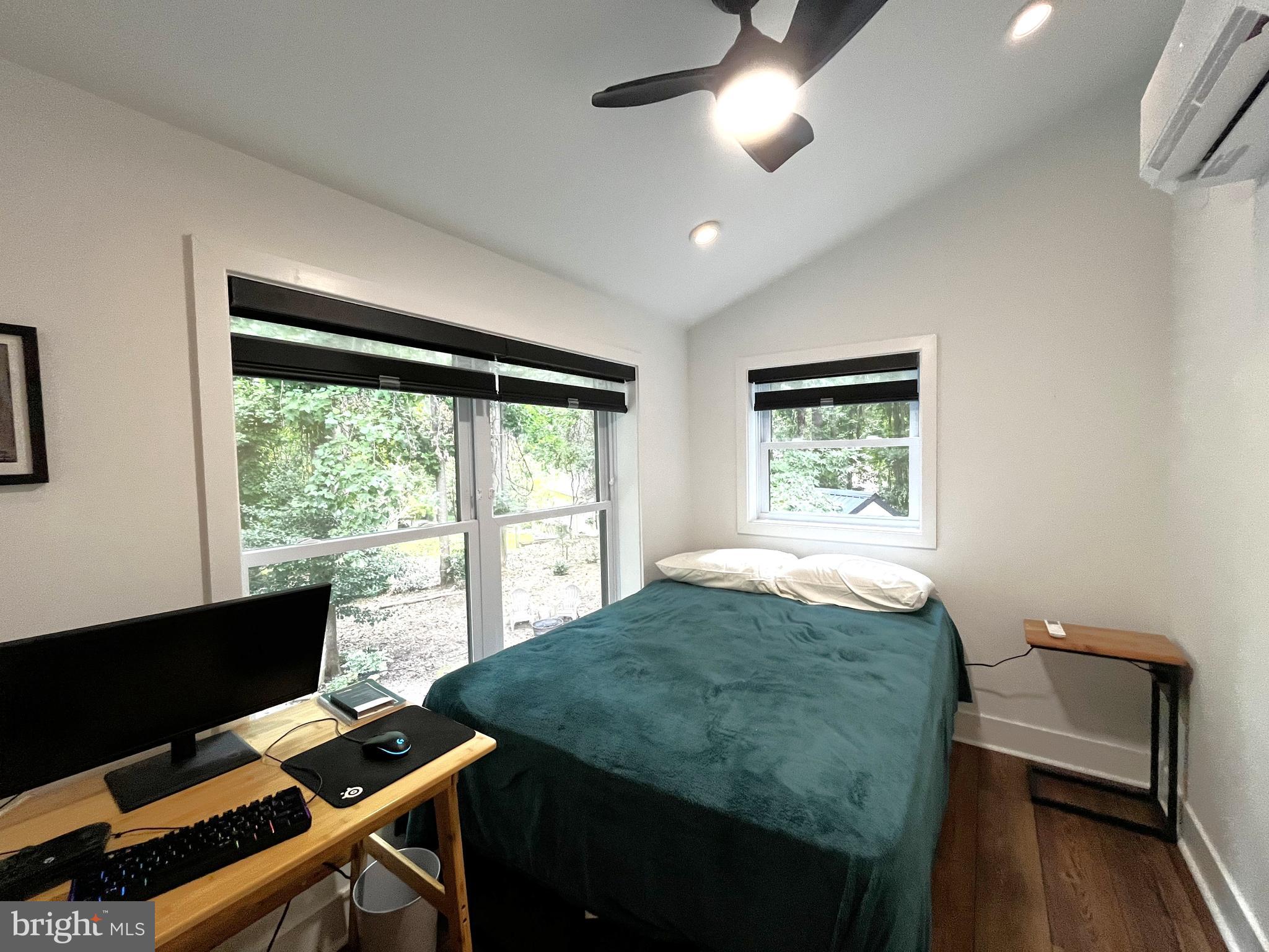 2020 Biglane Court, Unit A Huntingtown, MD 20639 - Photo 23 of 29 a view of a workspace with furniture and a window