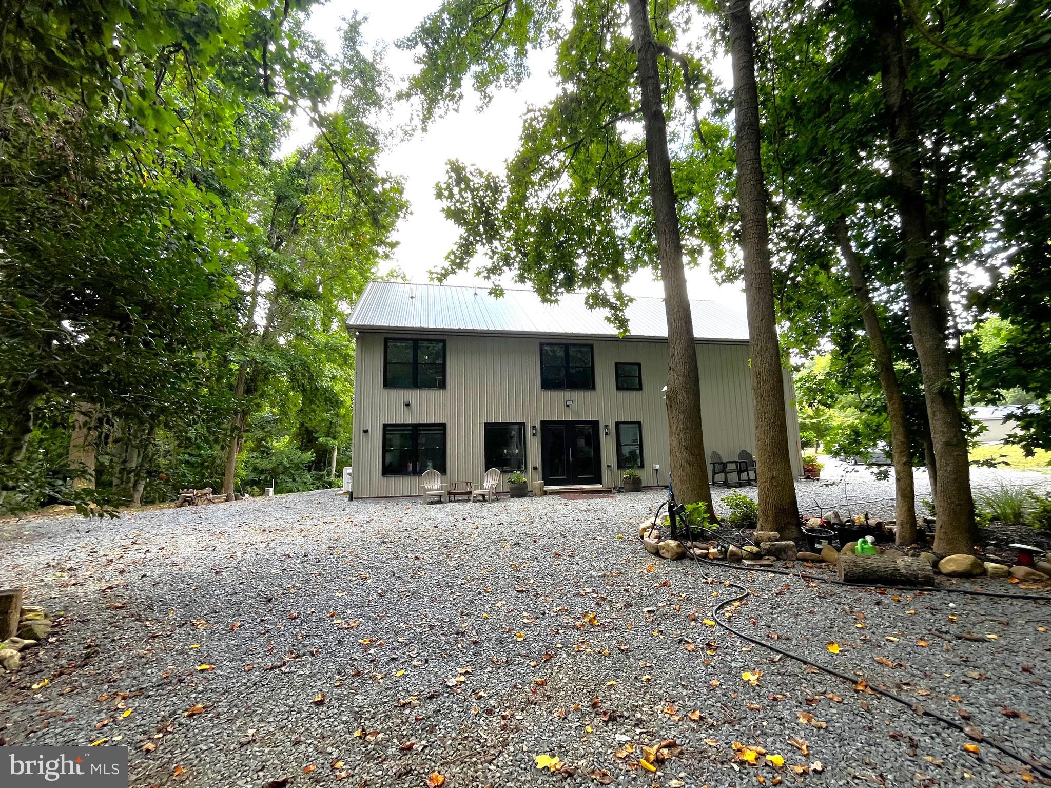 2020 Biglane Court, Unit A Huntingtown, MD 20639 - Photo 29 of 29 a front view of a house with garden