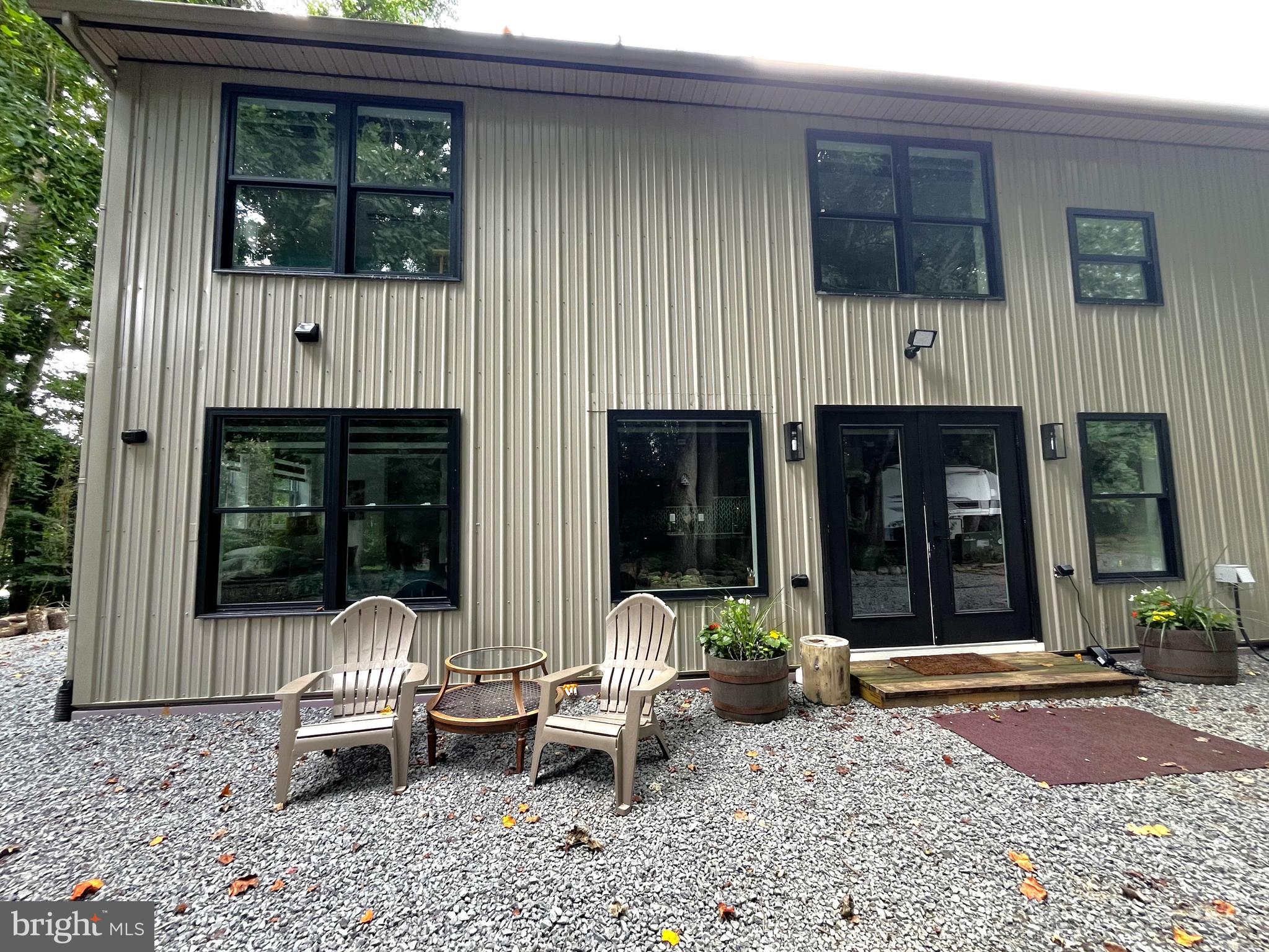 2020 Biglane Court, Unit A Huntingtown, MD 20639 - Photo 3 of 29 a front view of a house with porch