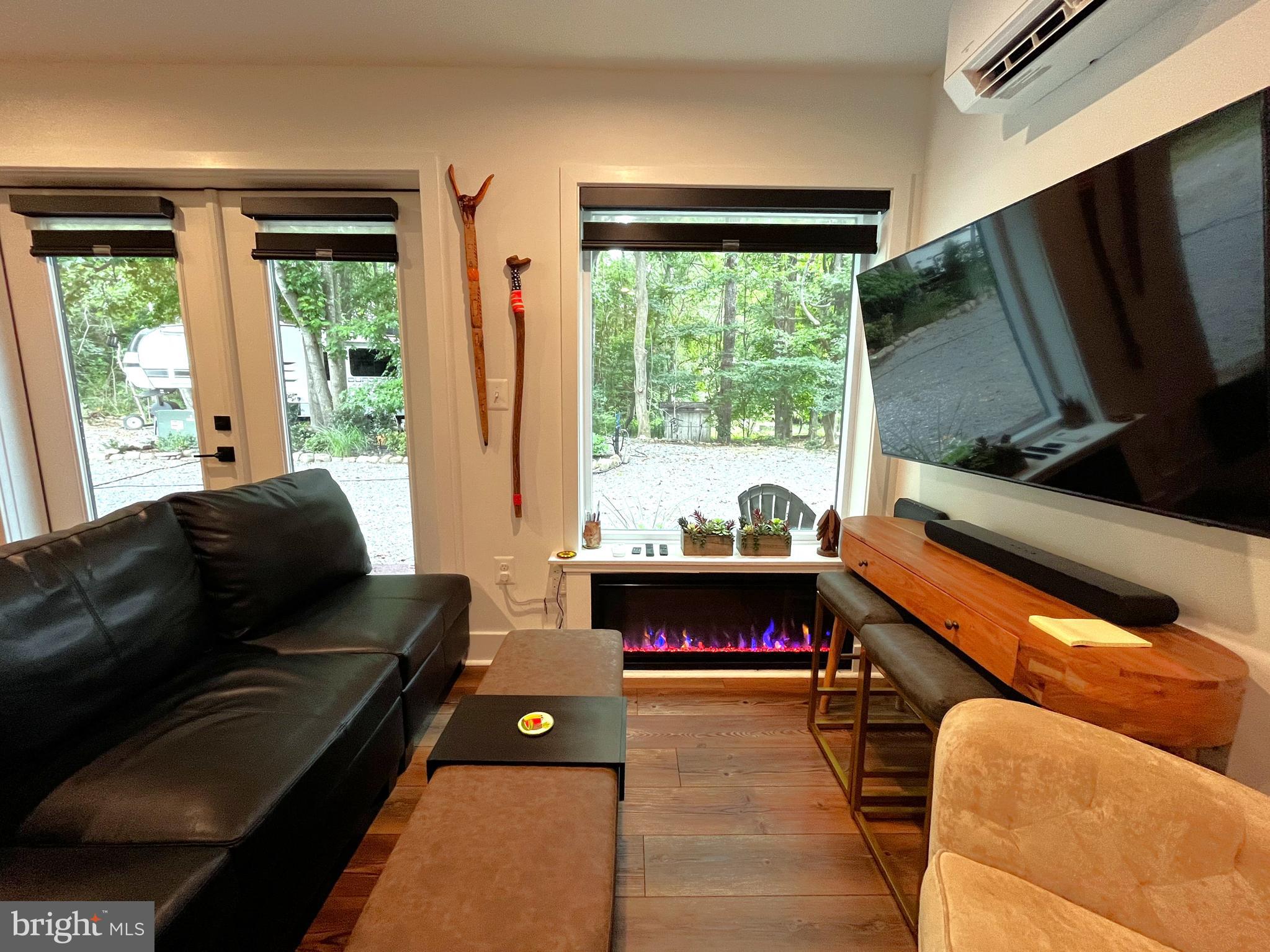 2020 Biglane Court, Unit A Huntingtown, MD 20639 - Photo 10 of 29 a living room with furniture and a flat screen tv