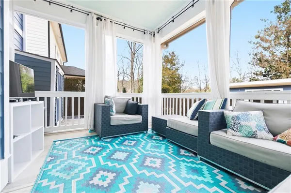 a living room with furniture and a rug