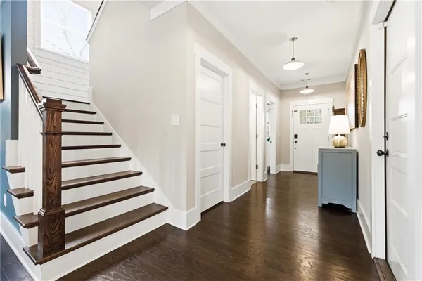 a view of a dining room with furniture and wooden floor