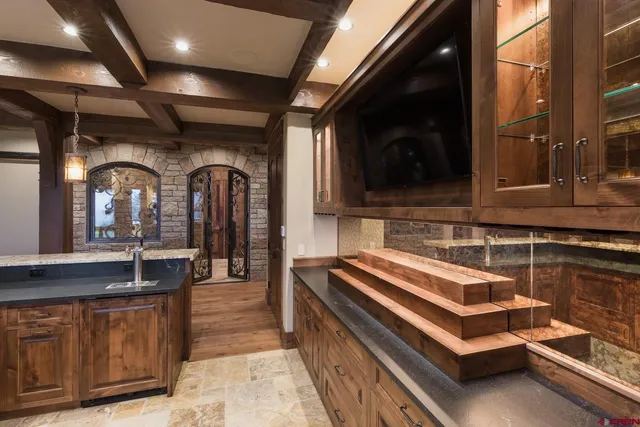 a kitchen with stainless steel appliances granite countertop a stove and a refrigerator