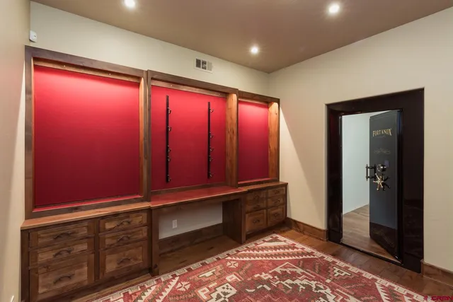 a view of an empty room with a fireplace