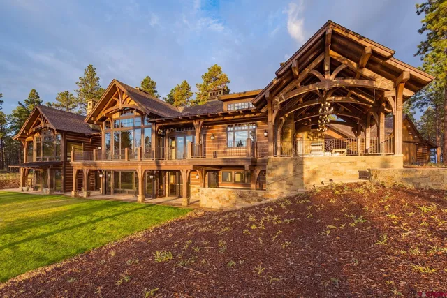 a front view of a building with a garden