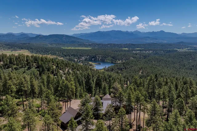 a view of a town with mountains in the background